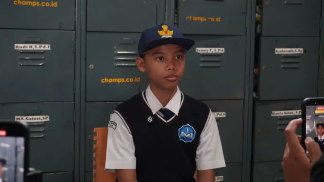 
					Muhammad Tris Akbarullah, siswa kelas 7.I di SMP Citra Bangsa asal Kelurahan Grogol yang mendapatkan manfaat dari adanya program RSSG. (Foto - Diskominfo Depok)